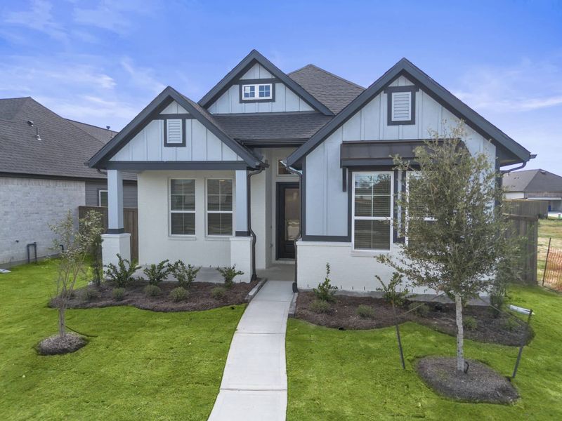 Front exterior of a new home in Riceland, Mont Belvieu, TX, highlighting curb appeal (Image 20). Front exterior of a new home in Riceland, Mont Belvieu, TX, highlighting curb appeal (Image 20).