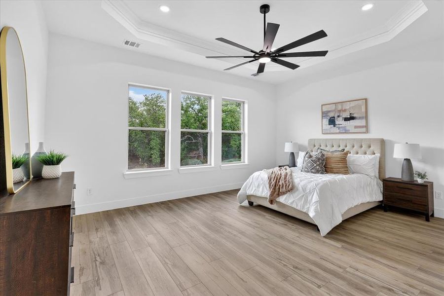 Bedroom featuring light wood-style flooring and ceiling fan
