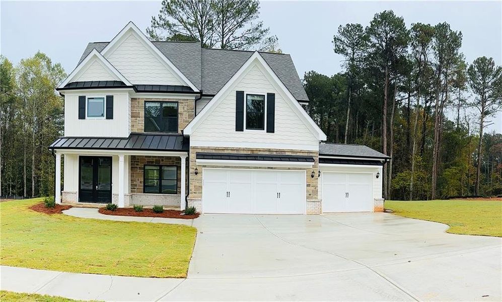 Front exterior of a new home in , Loganville, GA, highlighting curb appeal (Image 1). Front exterior of a new home in , Loganville, GA, highlighting curb appeal (Image 1).