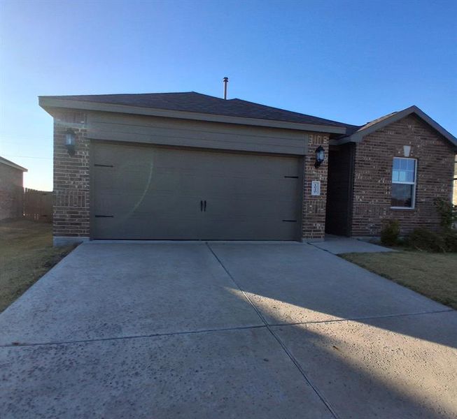 Front exterior of a new home in , Anna, TX, highlighting curb appeal (Image 1).