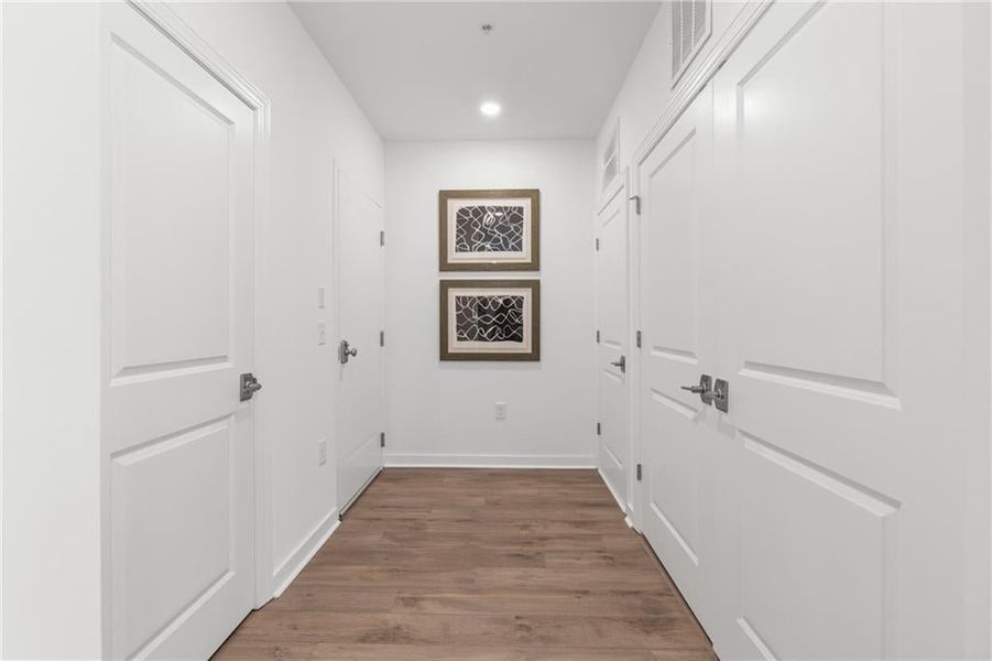 Open foyer with storage and laundry*Images from the model home. Not subject unit*