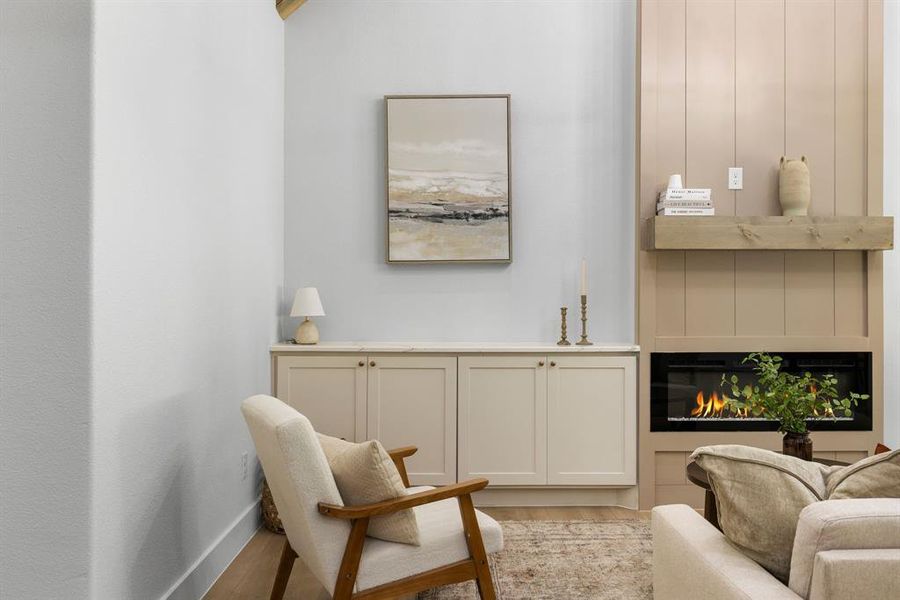 Sitting room with light hardwood / wood-style flooring