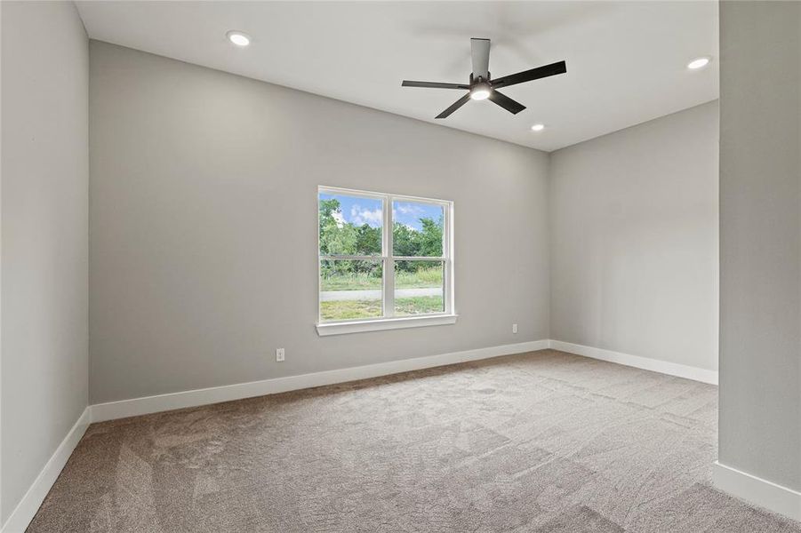 Bedroom with carpet, a ceiling fan, and recessed lighting