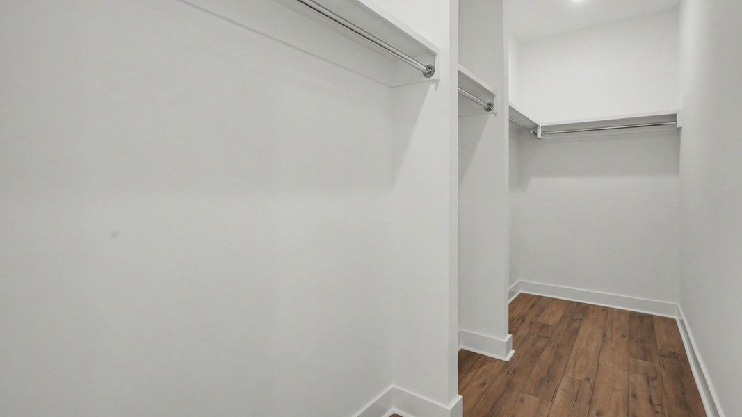 Primary closet with built-in shelves
