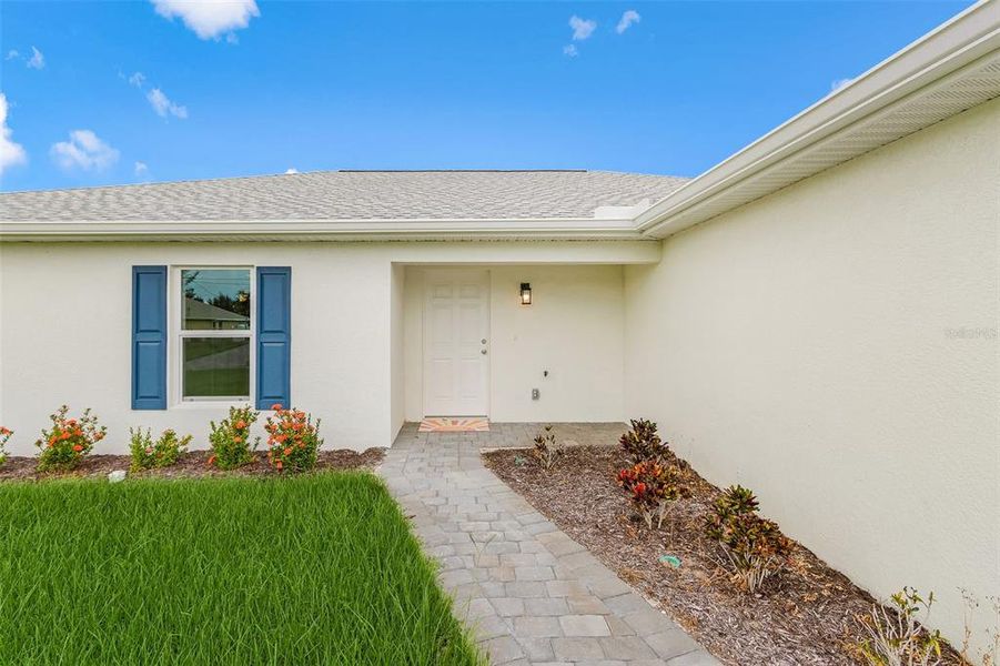 Front exterior of a new home in , Cape Coral, FL, highlighting curb appeal (Image 19). Front exterior of a new home in , Cape Coral, FL, highlighting curb appeal (Image 19).