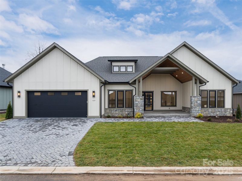 Front exterior of a new home in , Arden, NC, highlighting curb appeal (Image 1).