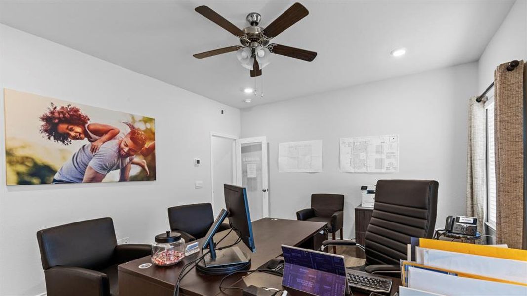 Dedicated office space featuring bright white walls, recessed lighting, and a ceiling fan with integrated lighting Dedicated office space featuring bright white walls, recessed lighting, and a ceiling fan with integrated lighting