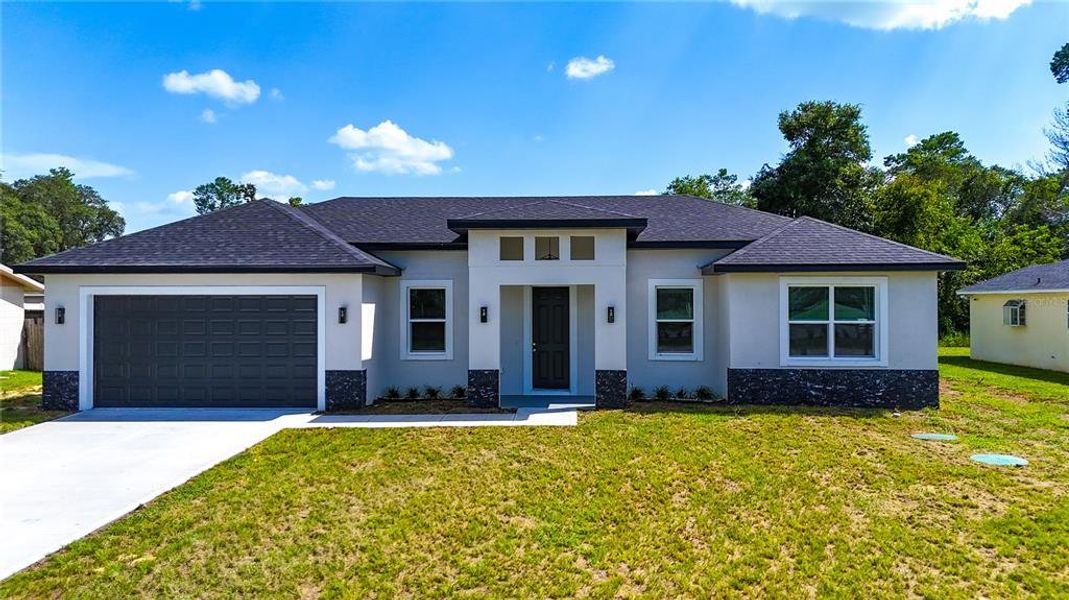 Front exterior of a new home in , Ocala, FL, highlighting curb appeal (Image 2).