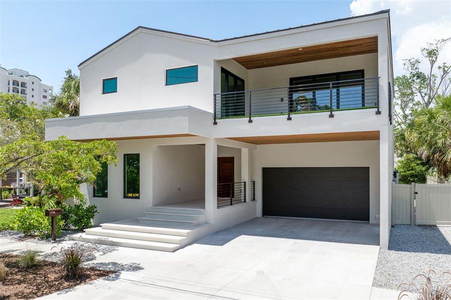 Front exterior of a new home in , Sarasota, FL, highlighting curb appeal (Image 32).