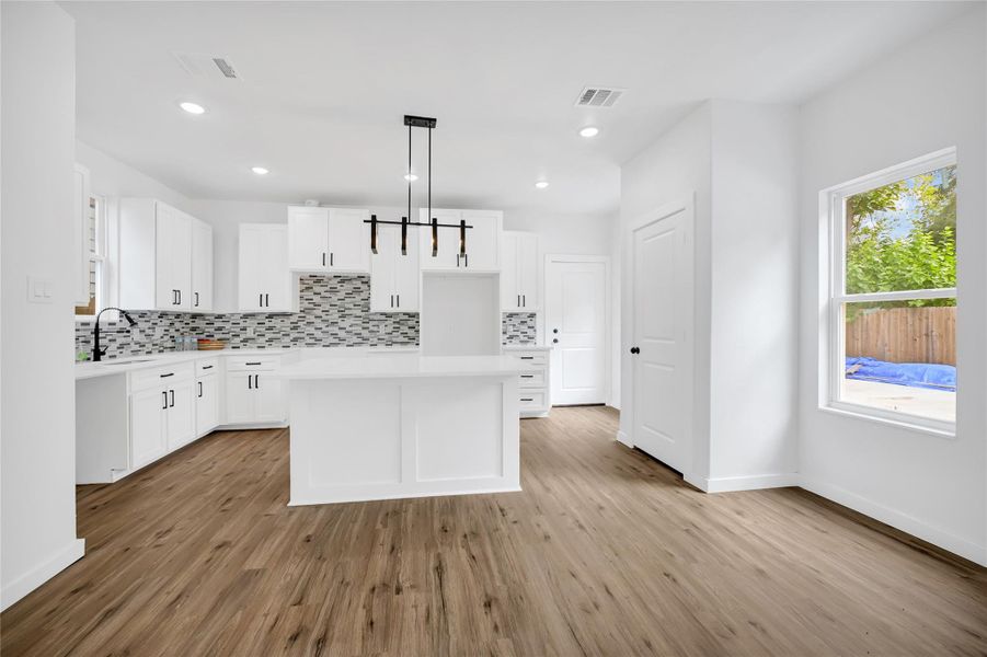 Large island with seating, perfect for entertaining and meal prep. Large island with seating, perfect for entertaining and meal prep.