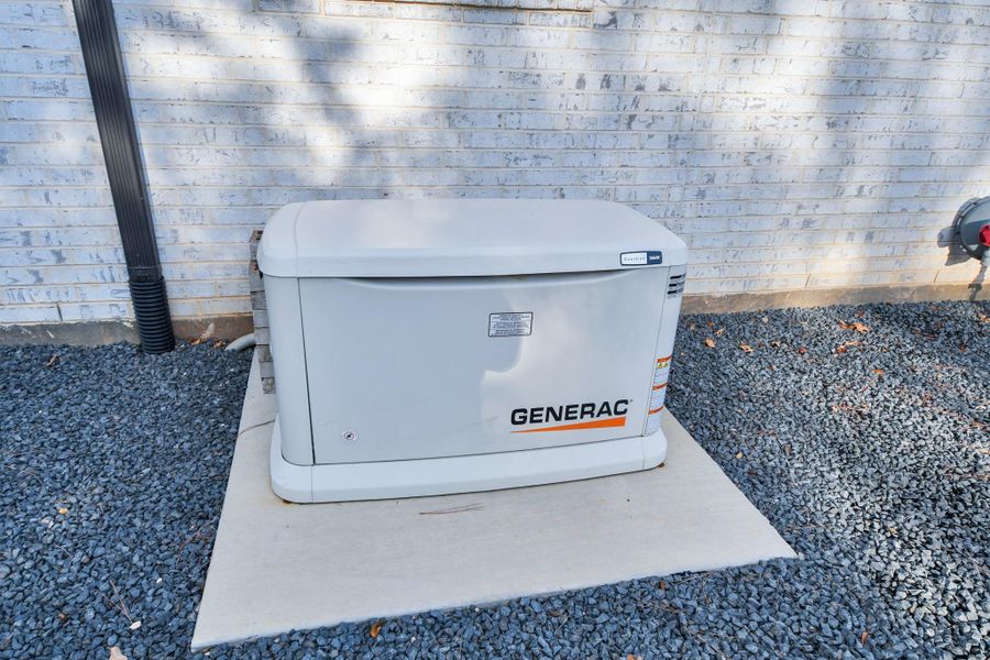 Reliable home generator installed on a concrete pad, providing peace of mind during power outages.