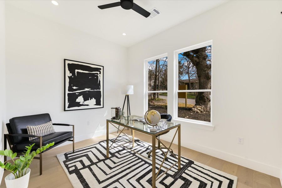 Sun-drenched and sophisticated. This space can be used as an office or additional bedroom and features large windows that frame the neighborhoods mature trees.