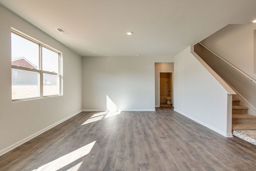 Representative unfurnished interior of a home built from the HAYDEN by D.R. Horton in The Parks, White House (Image 13).