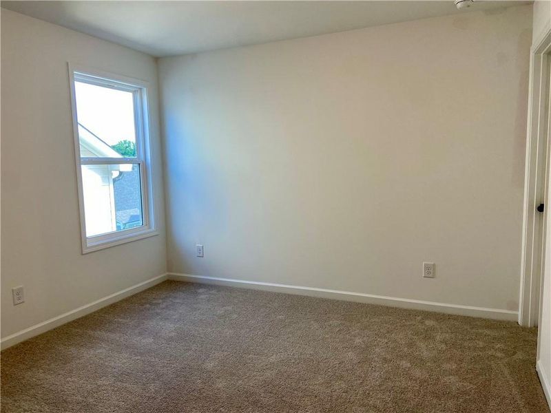 Spacious, unfurnished interior of a new home in Eastlyn Crossing, Flowery Branch (Image 20).