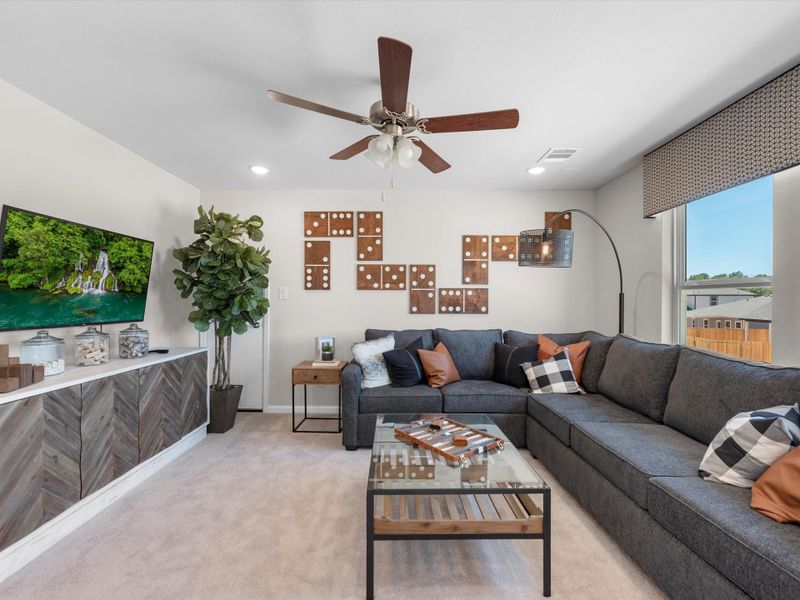 A living room with a couch and a table. A living room with a couch and a table.