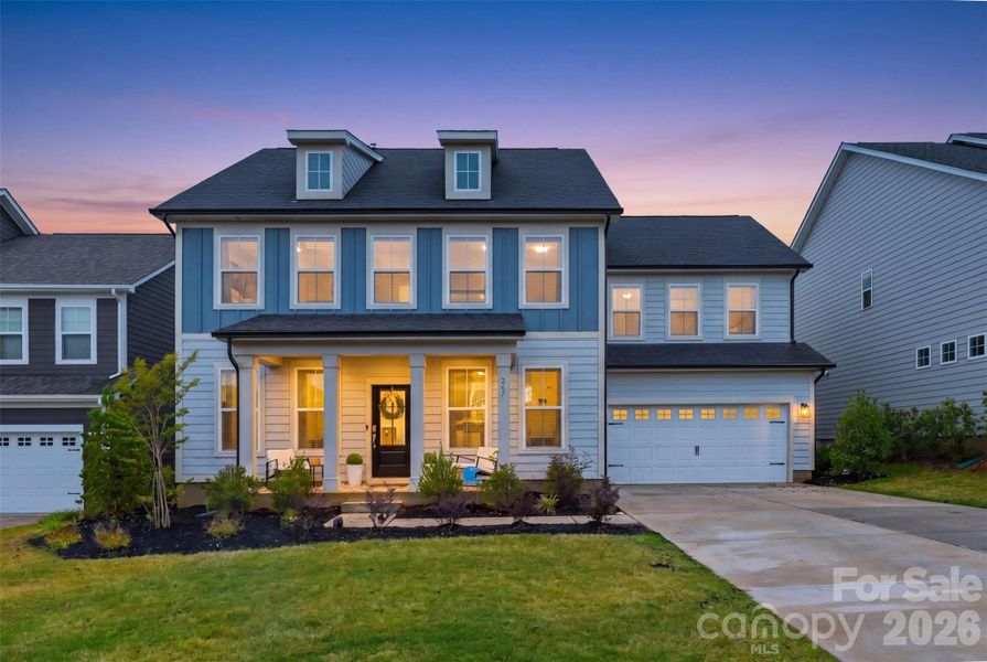 Front exterior of a new home in Lakeside Glen, York, SC, highlighting curb appeal (Image 21). Front exterior of a new home in Lakeside Glen, York, SC, highlighting curb appeal (Image 21).