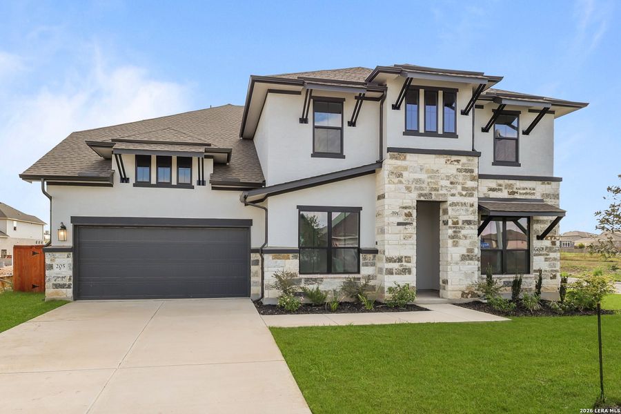 Front exterior of a new home in Megan's Landing, Castroville, TX, highlighting curb appeal (Image 27).