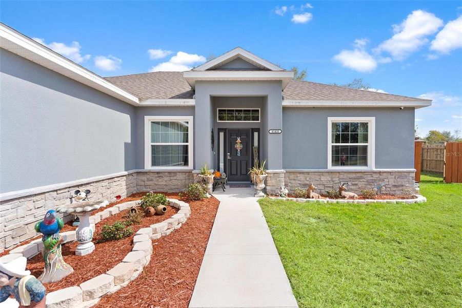 Front exterior of a new home in , Umatilla, FL, highlighting curb appeal (Image 24).