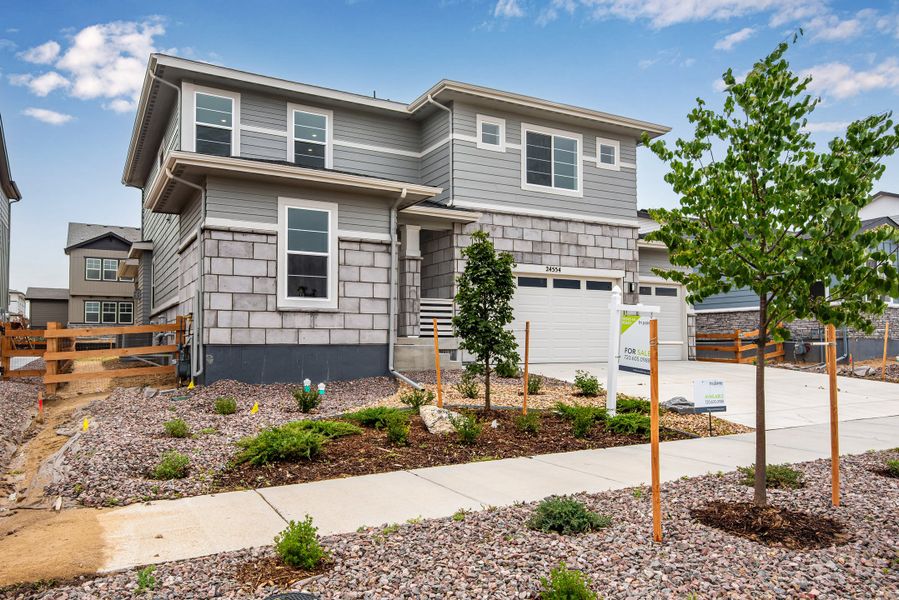 Front exterior of a new home in The Aurora Highlands, Aurora, CO, highlighting curb appeal (Image 24). Front exterior of a new home in The Aurora Highlands, Aurora, CO, highlighting curb appeal (Image 24).