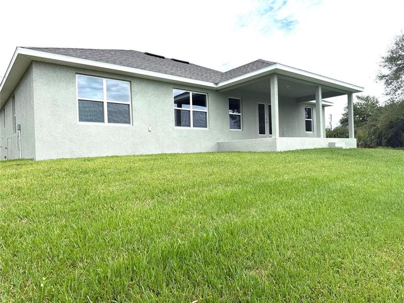 Front exterior of a new home in South Gulf Cove, Port Charlotte, FL, highlighting curb appeal (Image 21).