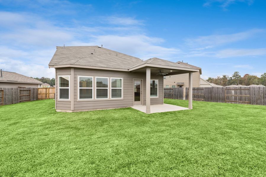 Exterior details and patio area of a home in Pinewood at Grand Texas, New Caney (Image 13).