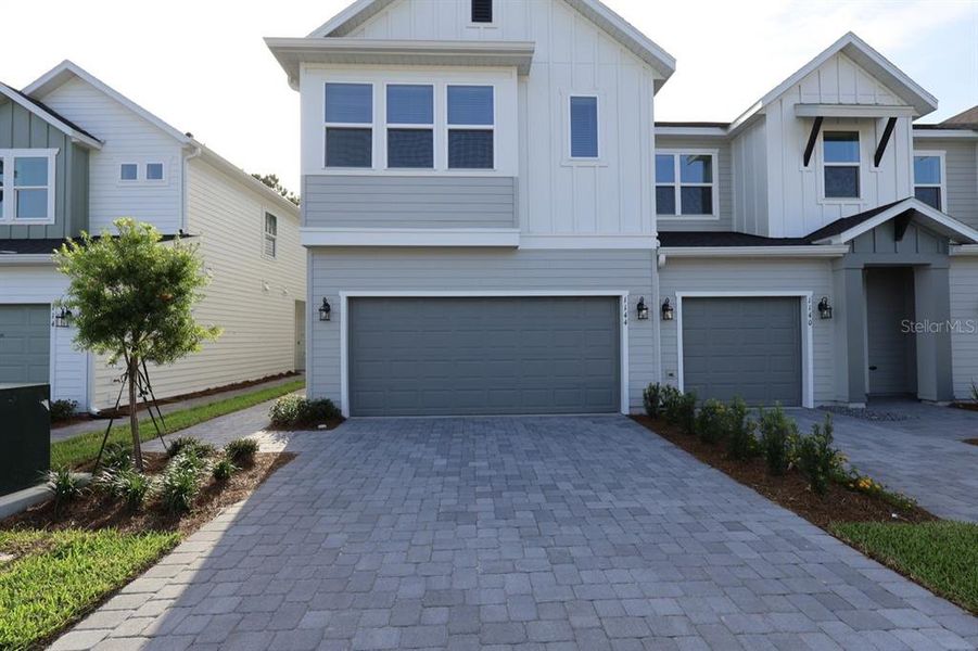 Front exterior of a new home in , Daytona Beach, FL, highlighting curb appeal (Image 1). Front exterior of a new home in , Daytona Beach, FL, highlighting curb appeal (Image 1).