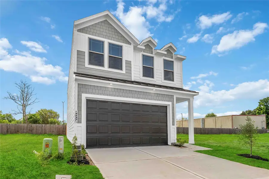 Front exterior of a new home in Cay Landing, Houston, TX, highlighting curb appeal (Image 2). Front exterior of a new home in Cay Landing, Houston, TX, highlighting curb appeal (Image 2).