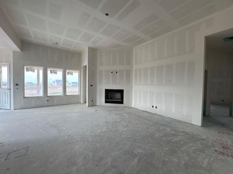 Unfurnished living room featuring a fireplace Unfurnished living room featuring a fireplace