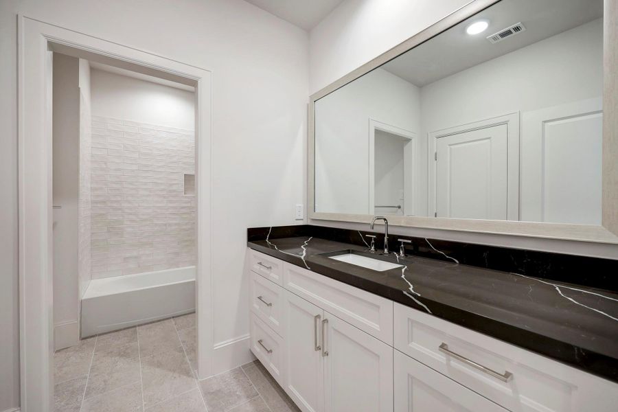 *Previous Model Home* Representative of a secondary bedroom  ensuite bath.