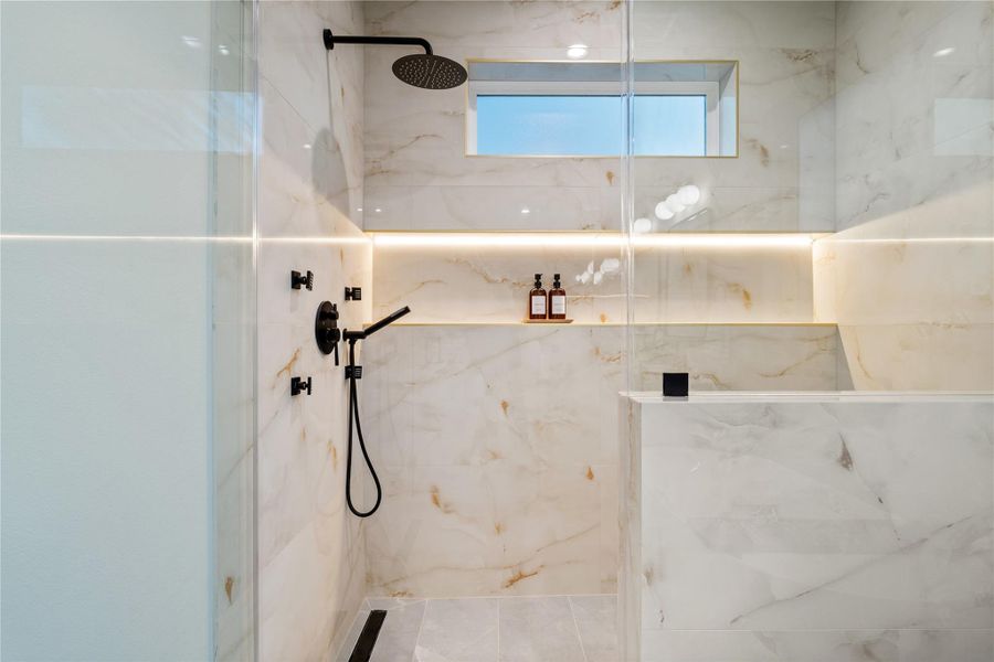 The oversized shampoo niche in the primary ensuite now features sleek LED lighting, adding both function and a spa-inspired glow. The oversized shampoo niche in the primary ensuite now features sleek LED lighting, adding both function and a spa-inspired glow.