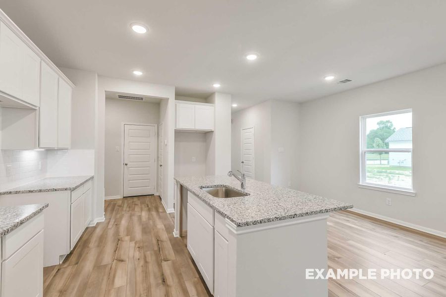 Furnished interior view inside a new home in Caney Creek Place, Conroe (Image 4).