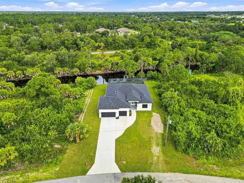 Front exterior of a new home in , Port Charlotte, FL, highlighting curb appeal (Image 29). Front exterior of a new home in , Port Charlotte, FL, highlighting curb appeal (Image 29).