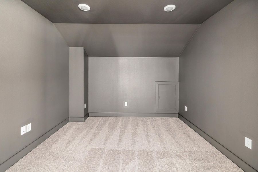 Additional living space with recessed lighting, carpet flooring, baseboards, and lofted ceiling Additional living space with recessed lighting, carpet flooring, baseboards, and lofted ceiling