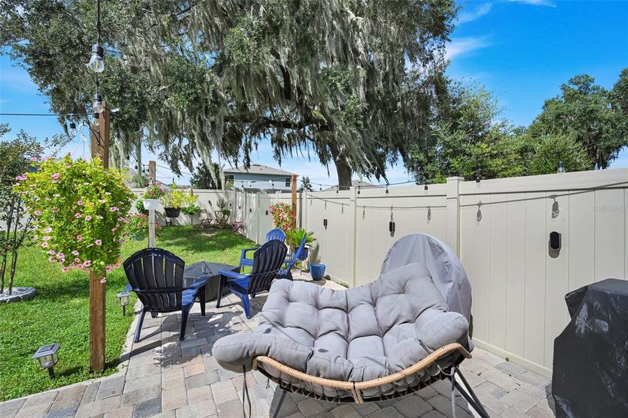 Exterior details and patio area of a home in Windrose, Apopka (Image 24).