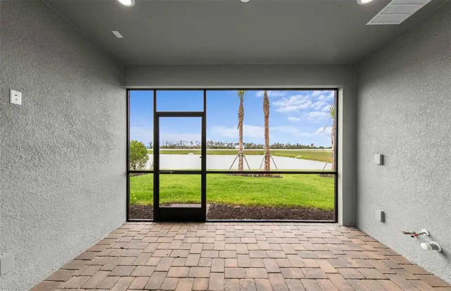 Exterior details and patio area of a home in Shores at Stillwater, Englewood (Image 18).