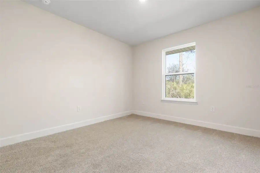 Representative unfurnished interior of a home built from the 2265 by Adams Homes in Flagler Estates, Hastings (Image 50).