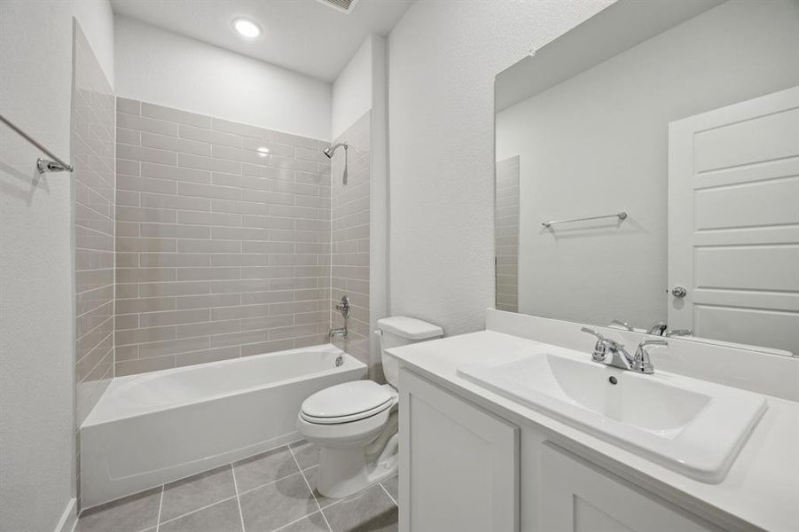 Bathroom in the Haylee home plan by Trophy Signature Homes - REPRESENTATIVE PHOTO