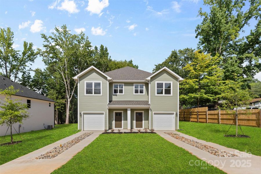Front exterior of a new home in , Charlotte, NC, highlighting curb appeal (Image 1).