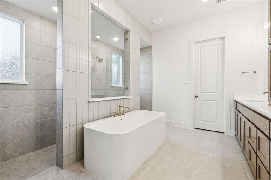 Our Addison III plan offers our signature owner's bath with freestanding tube and double walk through shower!