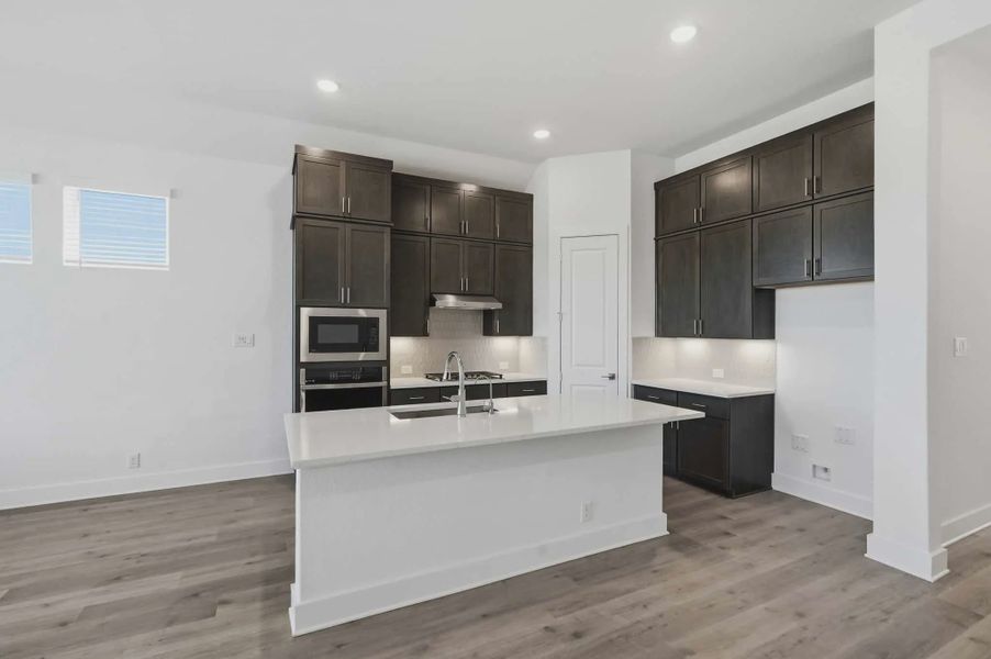Representative furnished interior of a home built from the Delos by Chesmar Homes in Prominence Urban, San Antonio (Image 4).