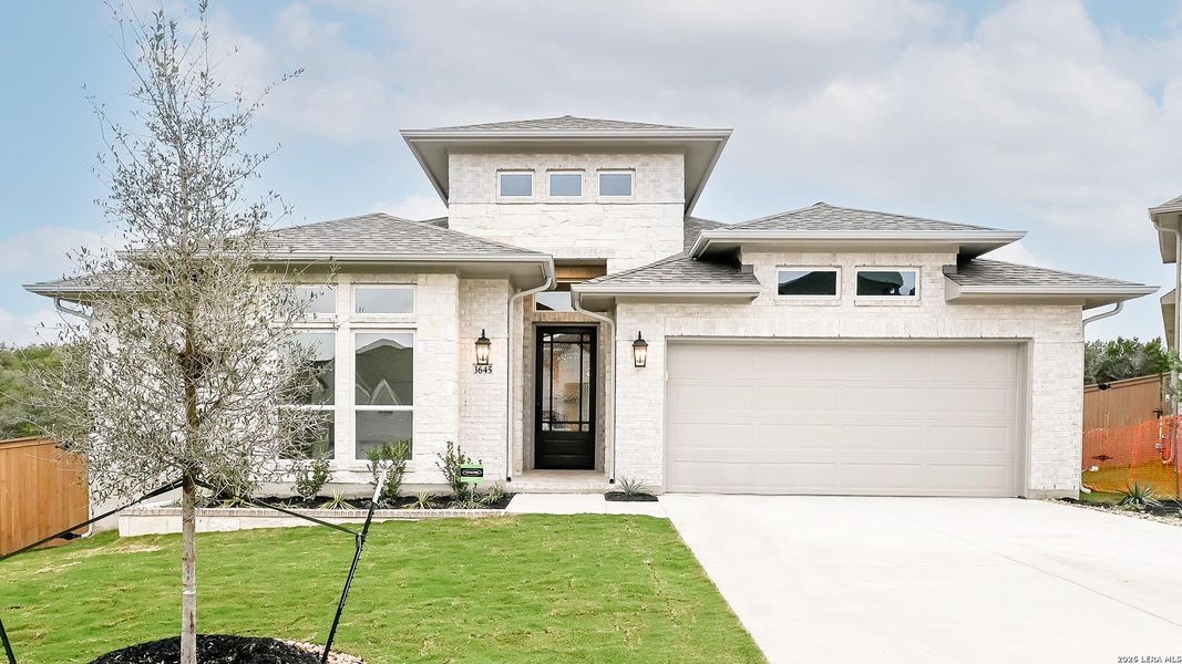 Front exterior of a new home in Johnson Ranch 55', Bulverde, TX, highlighting curb appeal (Image 21).