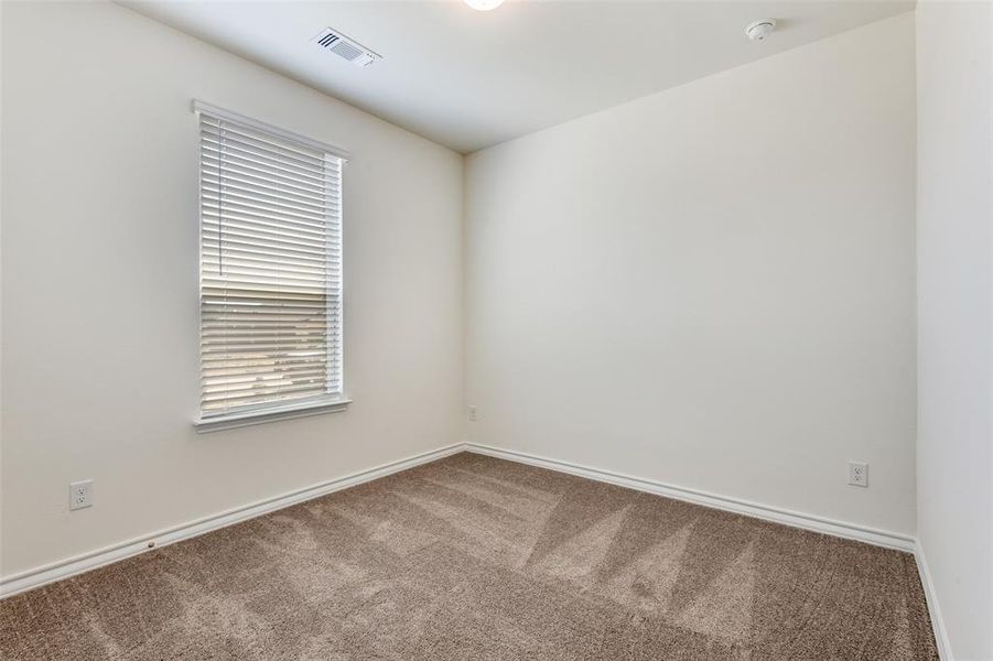 Unfurnished room with carpet floors and baseboards Unfurnished room with carpet floors and baseboards