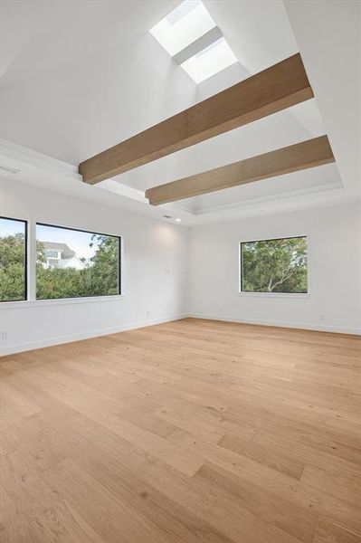 The large windows look out onto majestic mature oak tress.