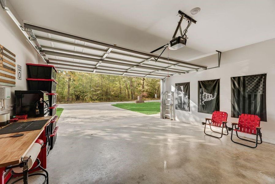 Garage featuring a garage door opener