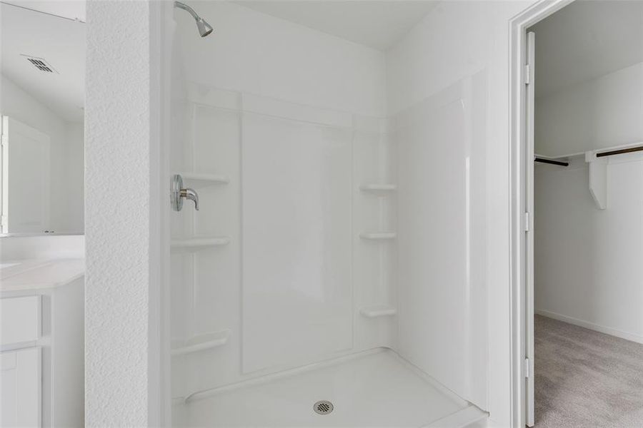 Bathroom featuring walk in shower