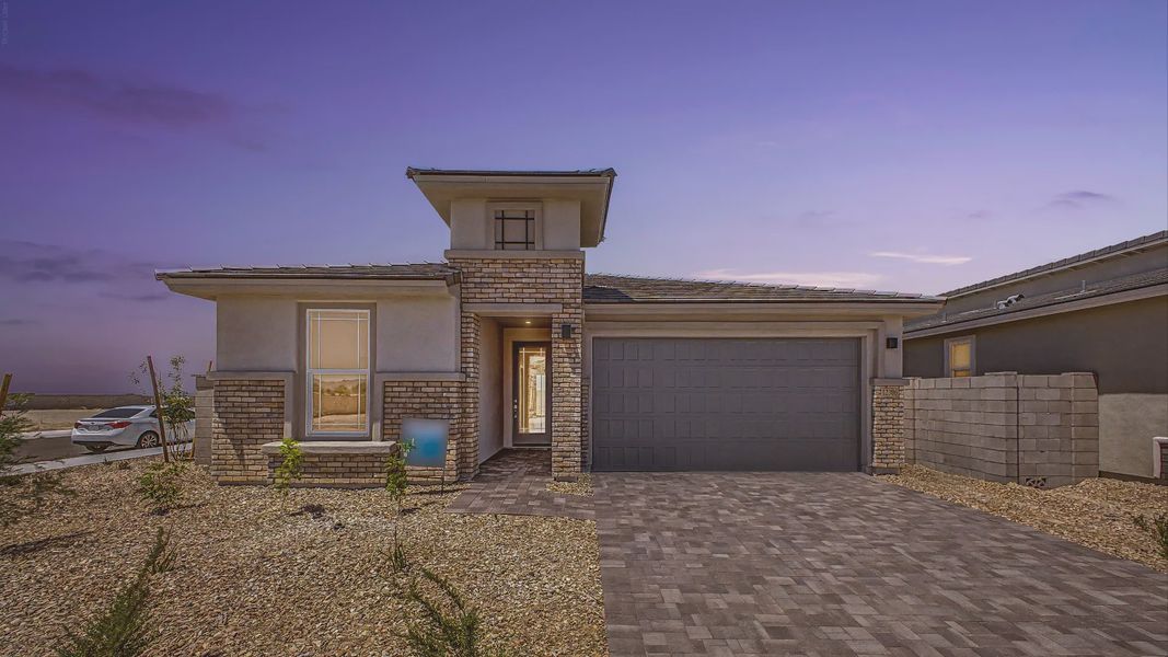 Front exterior of a new home in Teravalis, Buckeye, AZ, highlighting curb appeal (Image 1). Front exterior of a new home in Teravalis, Buckeye, AZ, highlighting curb appeal (Image 1).