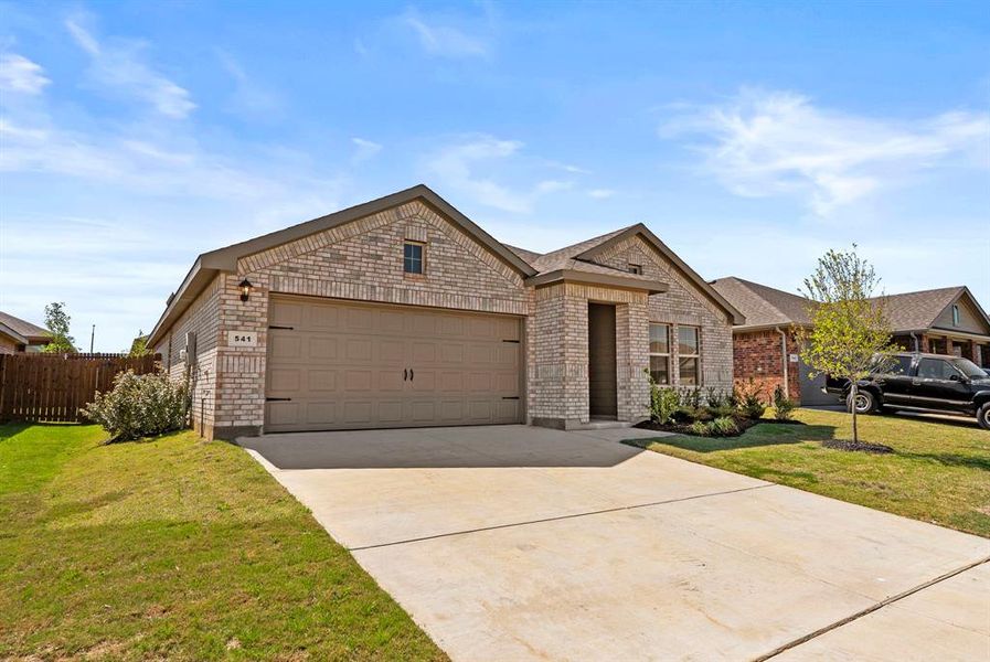 Front exterior of a new home in Meadowbrook Estates, Cleburne, TX, highlighting curb appeal (Image 2).