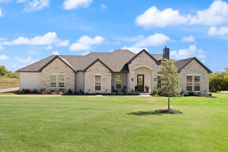 Front exterior of a new home in , Springtown, TX, highlighting curb appeal (Image 20). Front exterior of a new home in , Springtown, TX, highlighting curb appeal (Image 20).