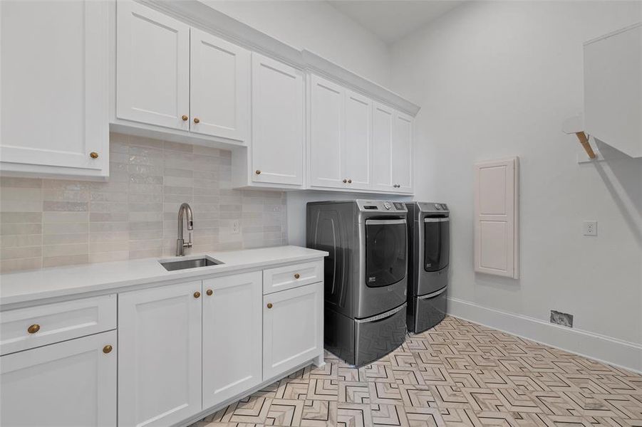 Laundry room with cabinet space and washer and dryer