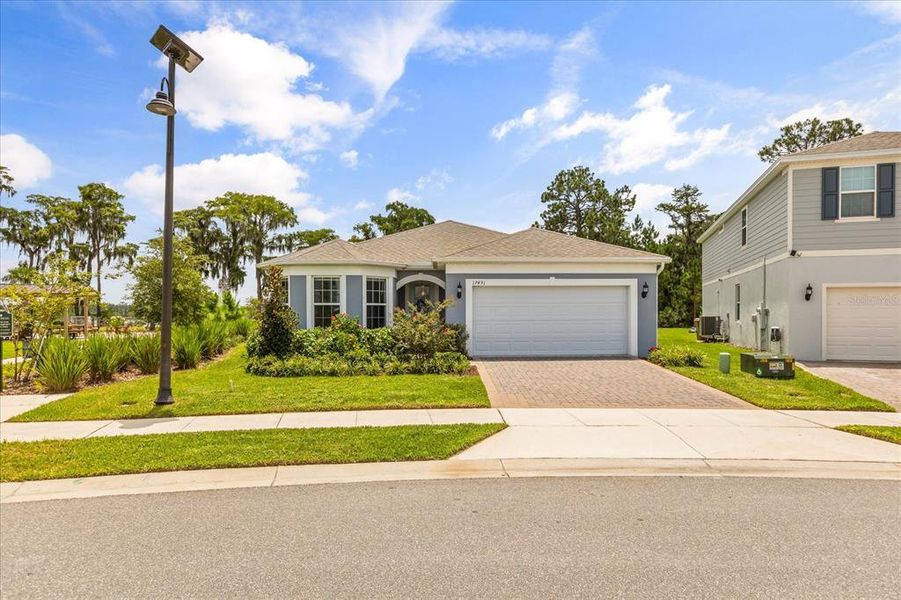 Front exterior of a new home in , Clermont, FL, highlighting curb appeal (Image 20). Front exterior of a new home in , Clermont, FL, highlighting curb appeal (Image 20).